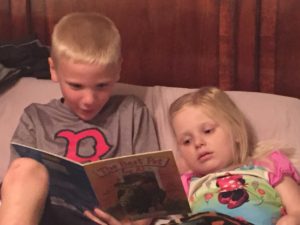 I can't tell you how much we all, especially Emma, miss this little man.  Here is a pic of Aiden reading to Emma on Monday before we left. 